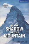 IN THE SHADOW OF THE MOUNTAIN. BOOK + CD PACK